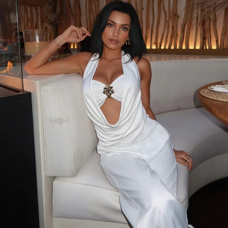 Neva Halterneck With Bralette Top In White - seated full-length shot on model - Miss Mosa By Akanksha