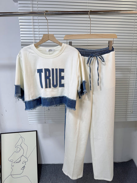 Noemi Knitted Soft Denim Co-ord Set In White - hanging product shot of co-ord top and trousers - Miss Mosa By Akanksha