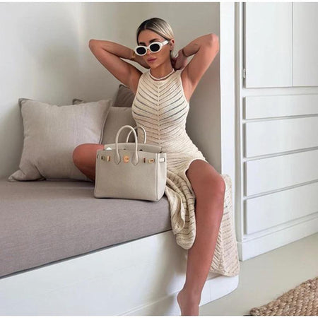 Orit Luxe Soft Knit Dress- Resortwear - styling shot on model seated, cream - Miss Mosa By Akanksha