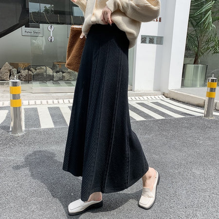 Paola Statement Woolen Pleated Skirt - side shot on model, black - Miss Mosa By Akanksha