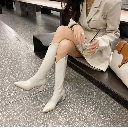 Rhodes Knee High Pointed Leather Boots - seated styling shot on model, cream - Miss Mosa By Akanksha