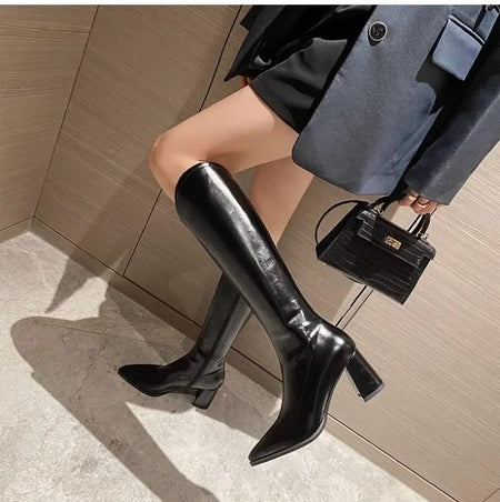 Rhodes Knee High Pointed Leather Boots - side shot on model standing, black - Miss Mosa By Akanksha