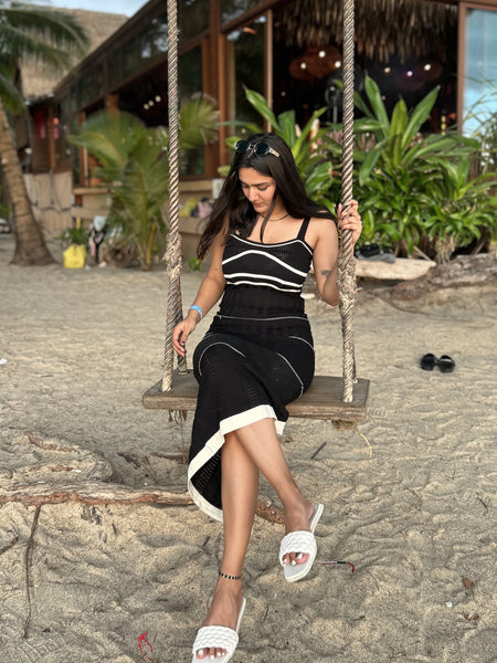 Rhodes Luxe Knit Dress In Black - seated full-length shot on model - Miss Mosa By Akanksha