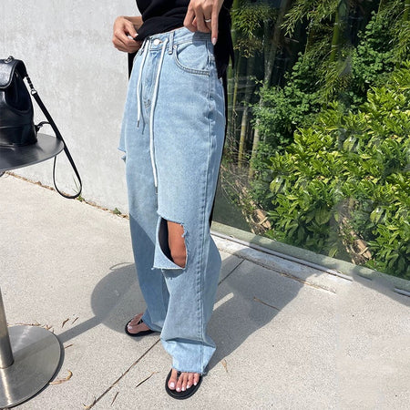 Riba Cropped Statement Denim Jeans - side shot on model, waist down, light blue - Miss Mosa By Akanksha