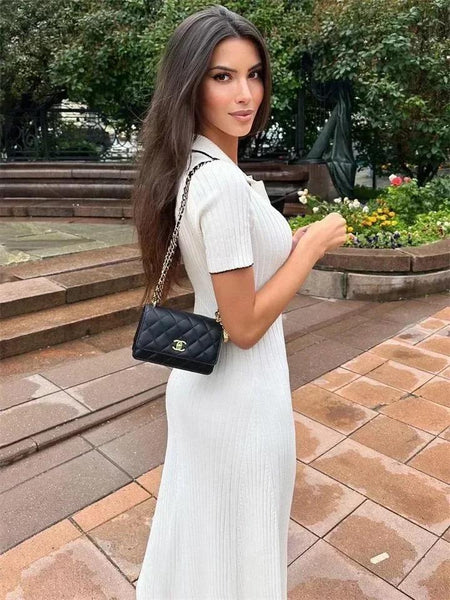 Rimona Luxe Soft Knit Dress - side shot on model outdoors, white - Miss Mosa By Akanksha