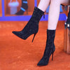 Ruby Short Sequined Statement Ankle Boots - front shot on seated model, black - Miss Mosa By Akanksha