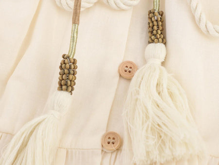Rumaya Summer Holiday Dress In Off-White - close-up of tassel belt detail - Miss Mosa By Akanksha