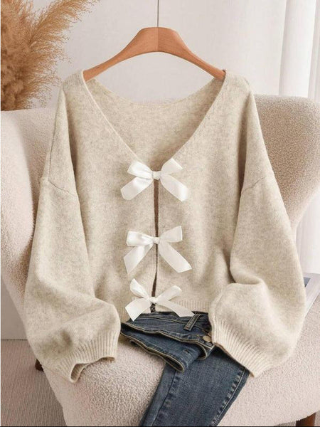 Rylee Bow Oversized Cardigan In Beige - front shot of the bow-back cardigan on hanger - Miss Mosa By Akanksha