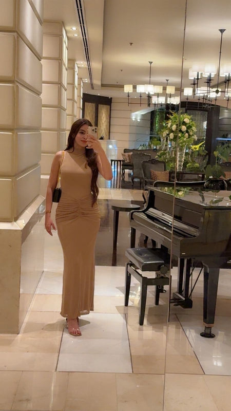 Saddle Statement Bodycon Maxi Dress In Brown - seated front shot on model - Miss Mosa By Akanksha