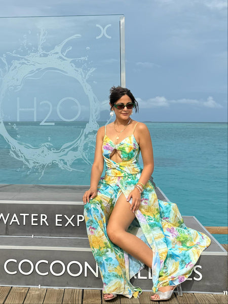 Salome Cutout Swimsuit With Skirt - seated shot, green and yellow floral print - Miss Mosa By Akanksha