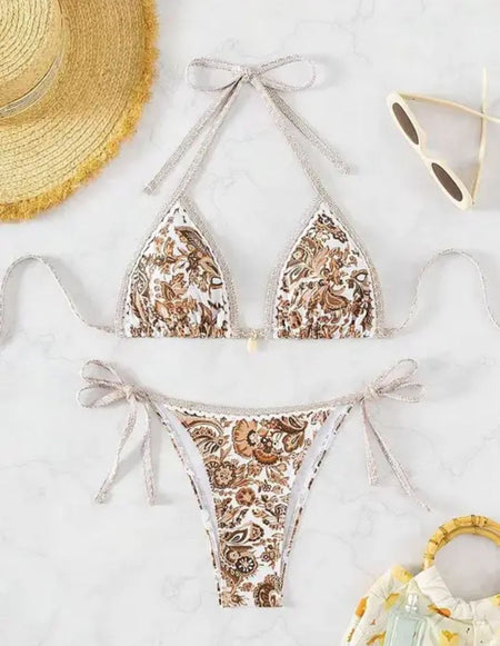 Sana Floral Bikini - flat-lay product shot with beach accessories, brown and white - Miss Mosa By Akanksha