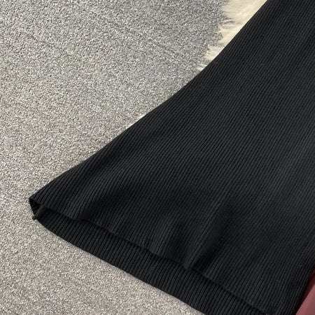 Sasha Pleated Woolen Dress - close-up of hem detail, black - Miss Mosa By Akanksha