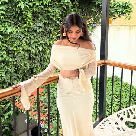 Saya Luxe Bodycon Maxi Dress - side shot on model on balcony, cream - Miss Mosa By Akanksha