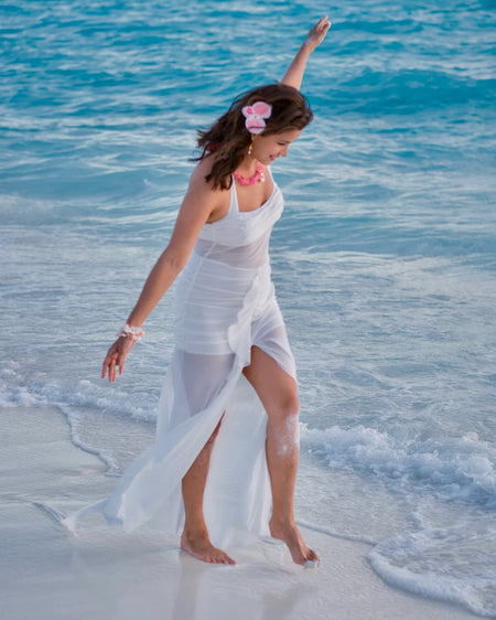Senna Bodycon Slit Maxi Dress In White - styling shot on model on beach - Miss Mosa By Akanksha