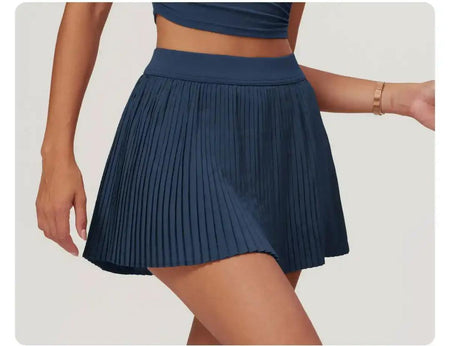 Sera Premium Activewear Set In Navy Blue - close-up shot of the pleated skirt on model - Miss Mosa By Akanksha