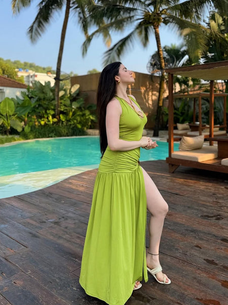 Serafina Luxe Slit Cut Maxi Dress In Green - side shot on model poolside - Miss Mosa By Akanksha