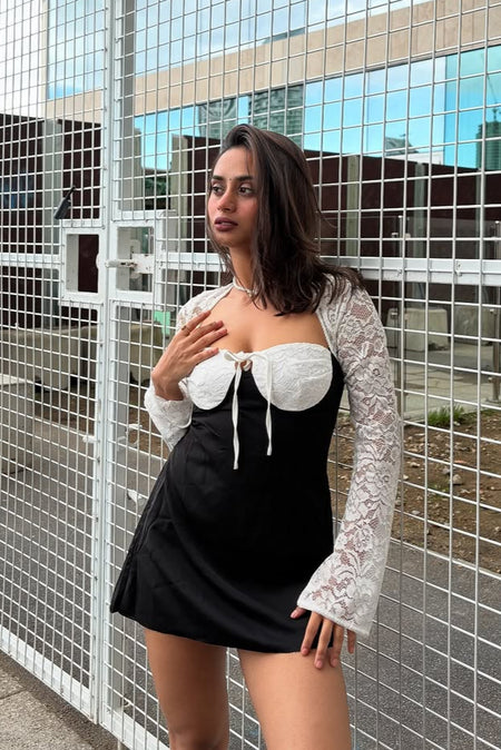 Serbia Lace Mini Dress In Black - side shot on model - Miss Mosa By Akanksha