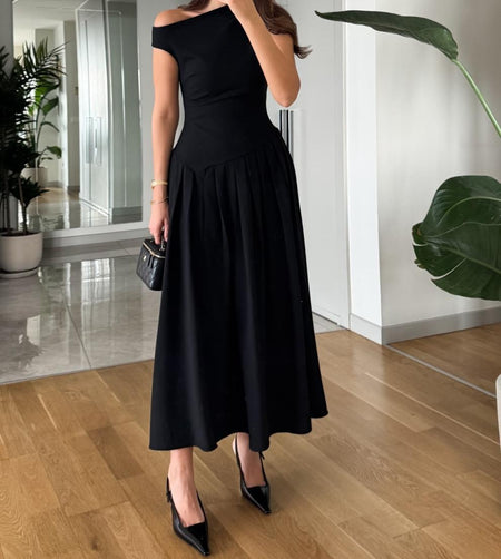 Sereia Statement Pleated Holiday Dress In Black - back full-length shot on model - Miss Mosa By Akanksha