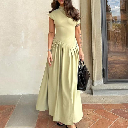Sereia Statement Pleated Holiday Dress In Pista Green - front full-length shot on model - Miss Mosa By Akanksha