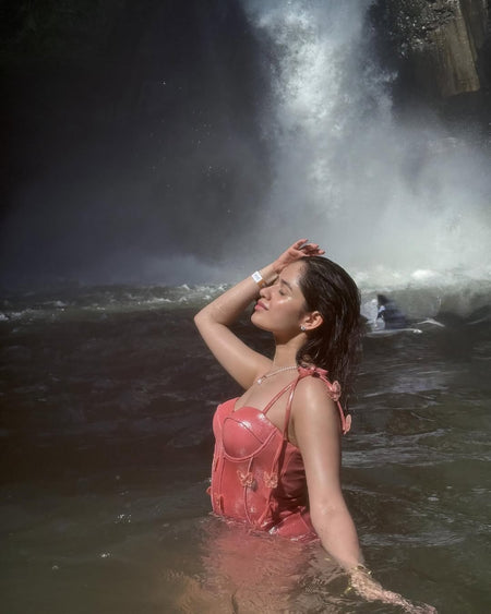Shane Swimsuit with Sarong Skirt In Pink - side shot on model in water - Miss Mosa By Akanksha
