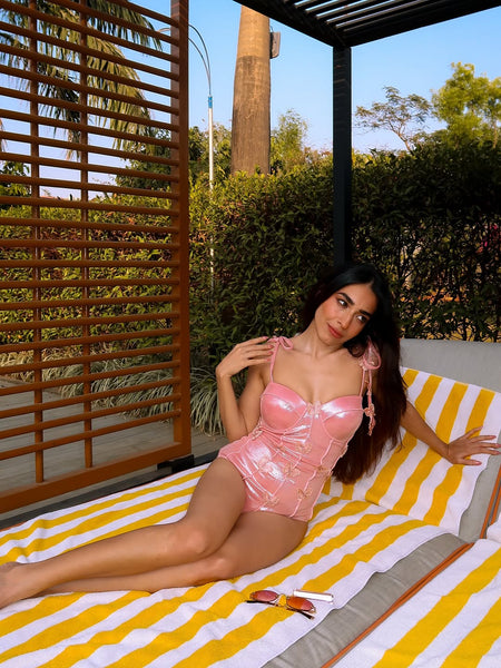 Shane Swimsuit with Sarong Skirt In Pink - front shot on model reclining - Miss Mosa By Akanksha