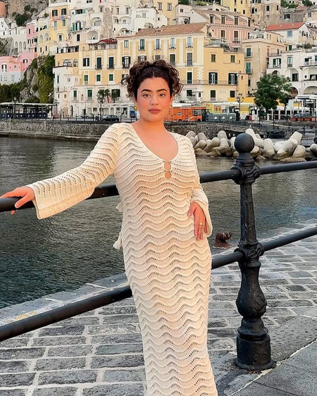 Shirly Luxe Crochet Knit Dress -Resortwear In Beige - front shot on model on harbour walkway - Miss Mosa By Akanksha