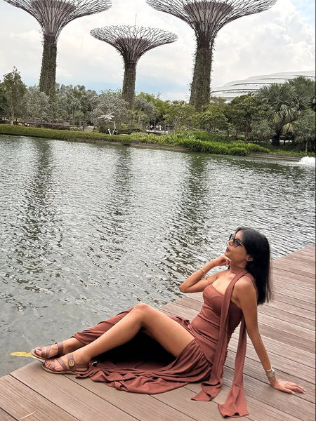 Sofiya Offshoulder Slit Maxi Dress With Scarf In Dark Brown - full-length shot on model seated - Miss Mosa By Akanksha