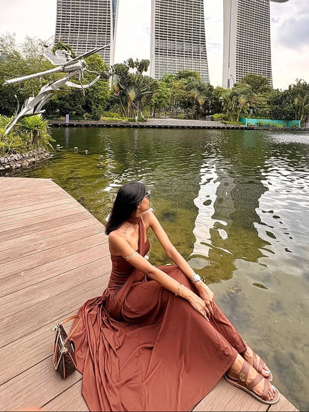 Sofiya Offshoulder Slit Maxi Dress With Scarf In Dark Brown - side shot on model seated - Miss Mosa By Akanksha