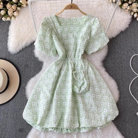 Susaine floral statement dress with bag - styled flat-lay shot, green - Miss Mosa By Akanksha