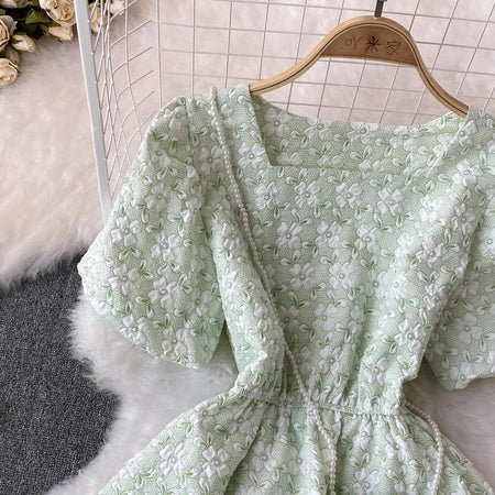 Susaine floral statement dress with bag - close-up of floral fabric, green - Miss Mosa By Akanksha
