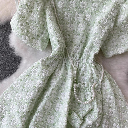 Susaine floral statement dress with bag - close-up of waist and bag detail, green - Miss Mosa By Akanksha