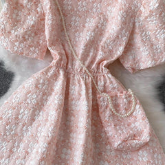 Susaine floral statement dress with bag - close-up of waist and bag detail, pink - Miss Mosa By Akanksha