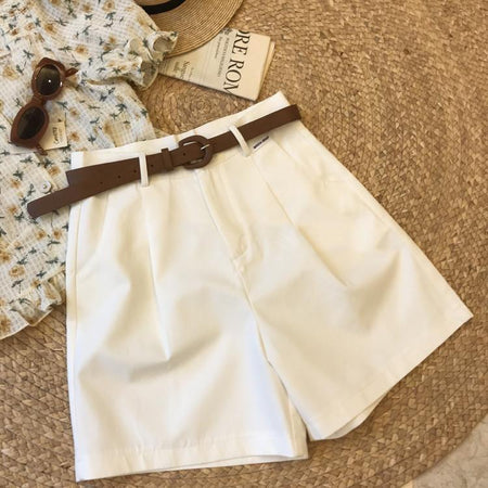 Sutton Statement Shorts With Belt In White - flat-lay product shot with belt and sun hat - Miss Mosa By Akanksha
