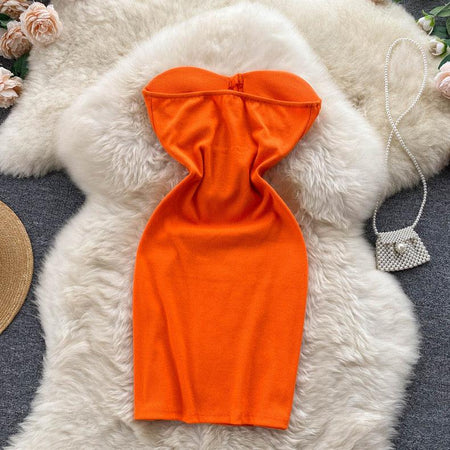 Suzie Tube Bodycon Dress In Orange - styled flat-lay shot, orange - Miss Mosa By Akanksha