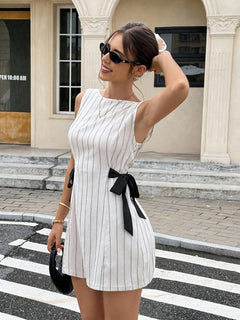 Tamar Bow Mini Dress - three-quarter shot, cream with grey pinstripes and black bow - Miss Mosa By Akanksha