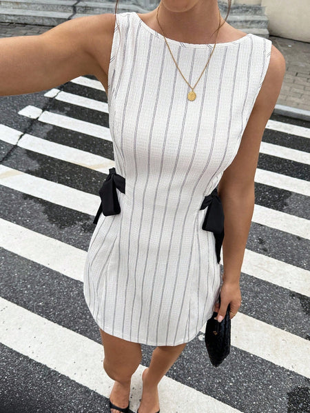Tamar Bow Mini Dress - close-up shot, cream with grey pinstripes and black bow - Miss Mosa By Akanksha