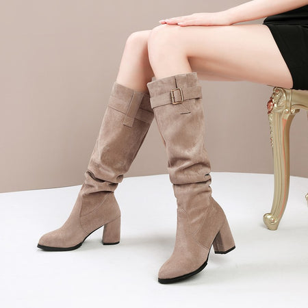 Taylor High Block Suede Boots - front shot on seated model, taupe - Miss Mosa By Akanksha