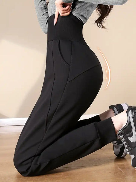 Telsa Slimming Premium Fleece Lined Jogger - side shot on model kneeling, black - Miss Mosa By Akanksha