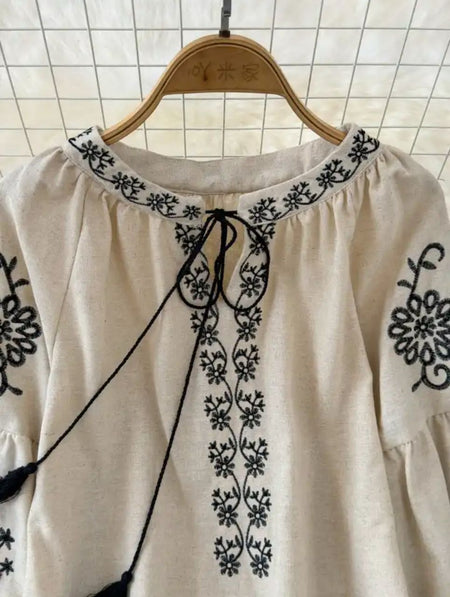 Teo Embroidered Summer Top - close-up of neckline embroidery detail on hanger, beige and black - Miss Mosa By Akanksha