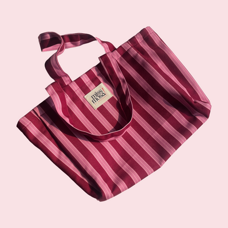 The Miss Mosa Tote Bag - Pink Striped - close-up of bag with brand label, pink and maroon striped - Miss Mosa By Akanksha