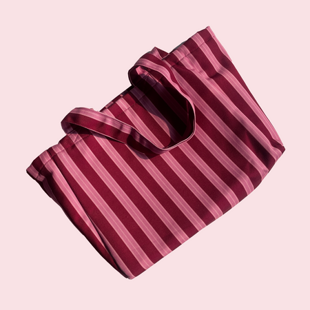 The Miss Mosa Tote Bag - Pink Striped - close-up of folded bag with handles, pink and maroon striped - Miss Mosa By Akanksha