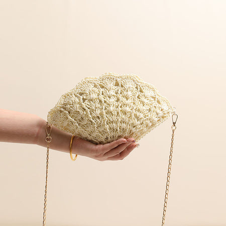 Twirly Shell Sling Bag With Chain - front shot held in hand, cream - Miss Mosa By Akanksha
