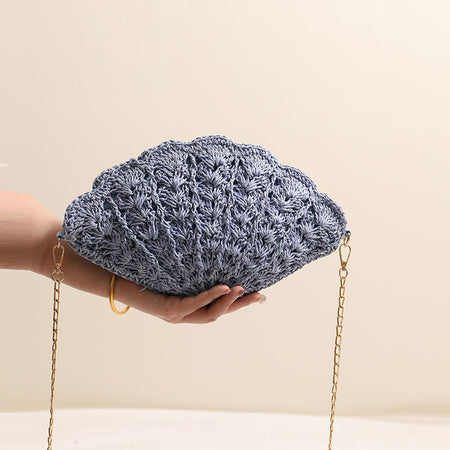 Twirly Shell Sling Bag With Chain - front shot held in hand, dusty blue - Miss Mosa By Akanksha