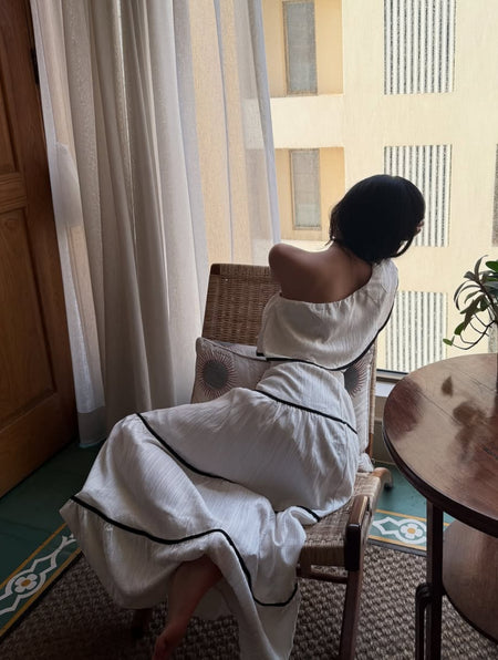 Valentino One-Shoulder Top With Skirt Coord Sets In White - seated back shot on model - Miss Mosa By Akanksha