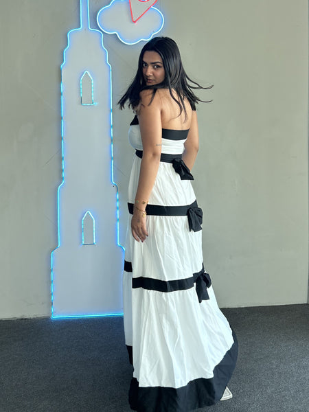 Wesley Offshoulder Holiday Maxi Dress In White - back shot on model indoors - Miss Mosa By Akanksha