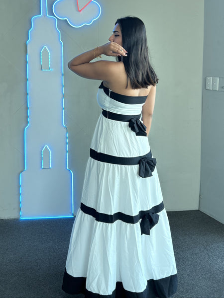 Wesley Offshoulder Holiday Maxi Dress In White - side shot on model indoors - Miss Mosa By Akanksha
