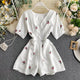 Alicia Floral Romper - back shot on hanger, white floral - Miss Mosa By Akanksha
