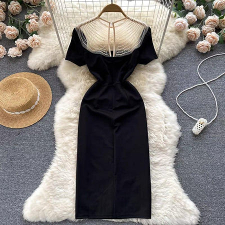 Delsa Statement Dress In Black - back shot on hanger, black - Miss Mosa By Akanksha