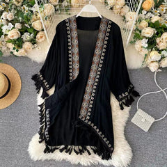 Leah Tasseled Cape - front shot on hanger, black - Miss Mosa By Akanksha