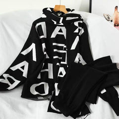 Liber Tracksuit with scarf - styled flat-lay shot, black - Miss Mosa By Akanksha